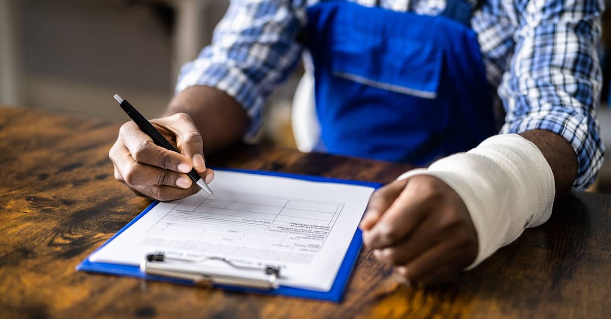 Injured worker filling out workers' comp claim. | Colling Gilbert Wright